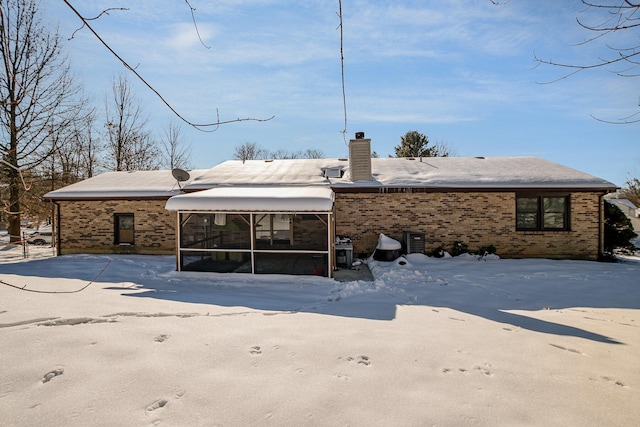 back of house featuring central AC