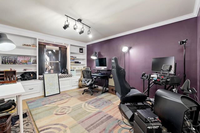 home office featuring built in shelves and crown molding