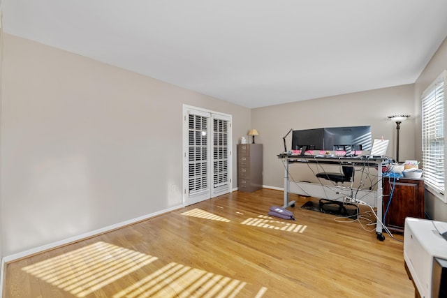 home office with hardwood / wood-style floors