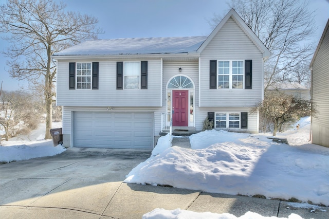 bi-level home featuring a garage