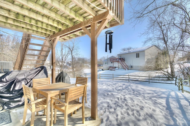 view of snow covered patio