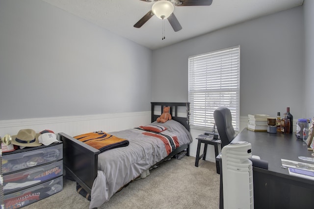 bedroom with ceiling fan and light colored carpet