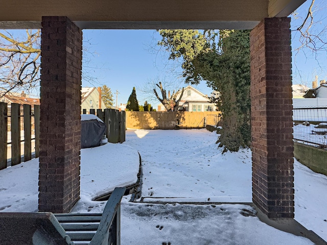 view of yard layered in snow