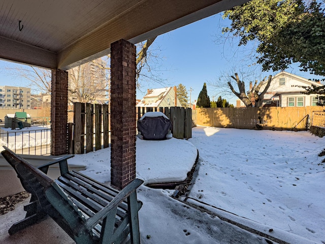 view of yard covered in snow