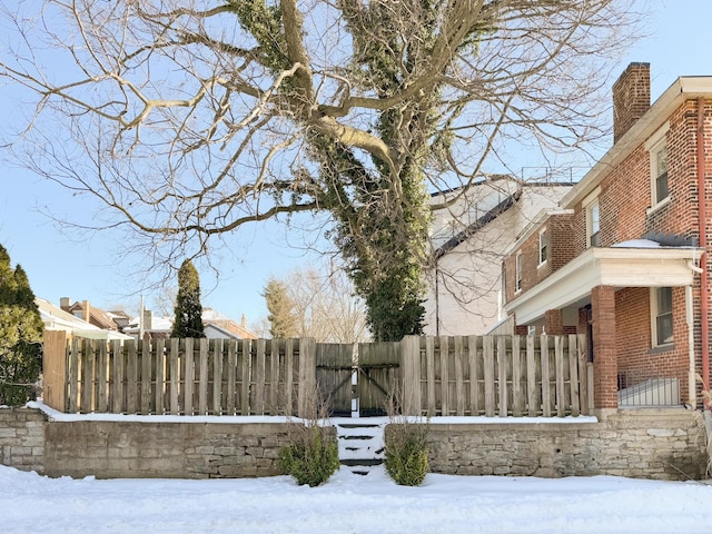 view of yard layered in snow