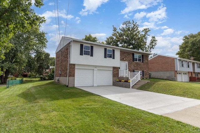 bi-level home featuring a front yard and a garage