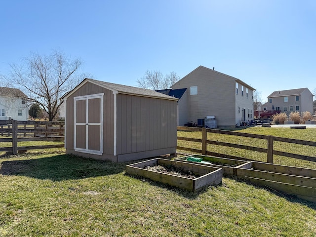 view of shed with a garden and fence