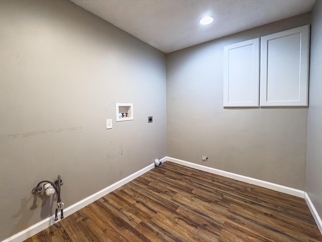 clothes washing area with cabinet space, electric dryer hookup, washer hookup, and hookup for a gas dryer