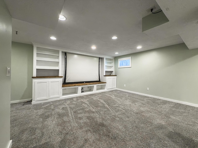 carpeted home theater room with recessed lighting and baseboards