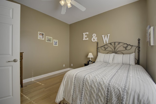 bedroom with ceiling fan and light hardwood / wood-style flooring