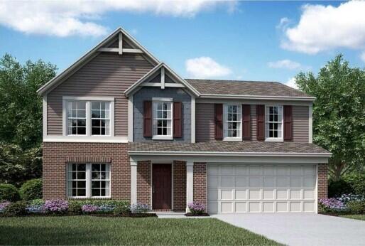 view of front facade featuring a front yard and a garage