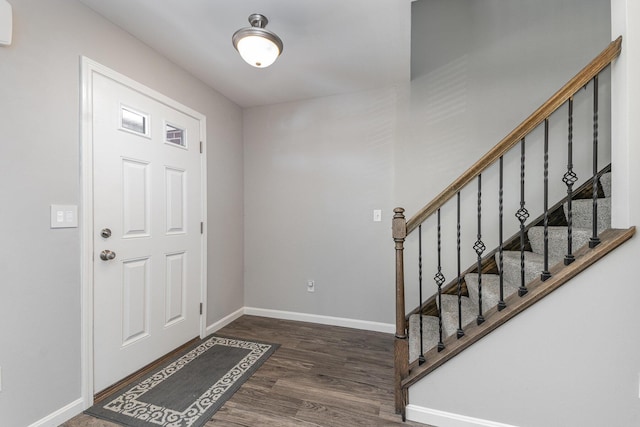 foyer with dark hardwood / wood-style floors