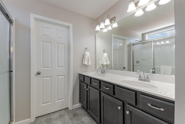 bathroom featuring an enclosed shower and vanity