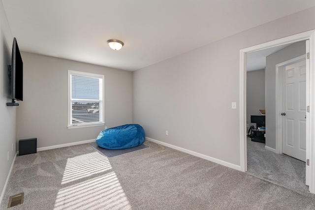 exercise area featuring light carpet