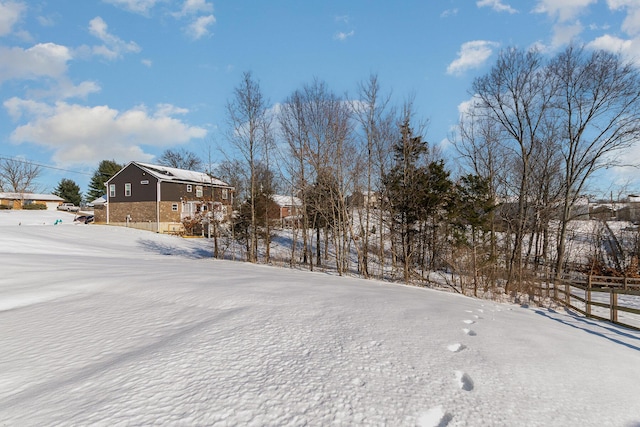 view of yard layered in snow