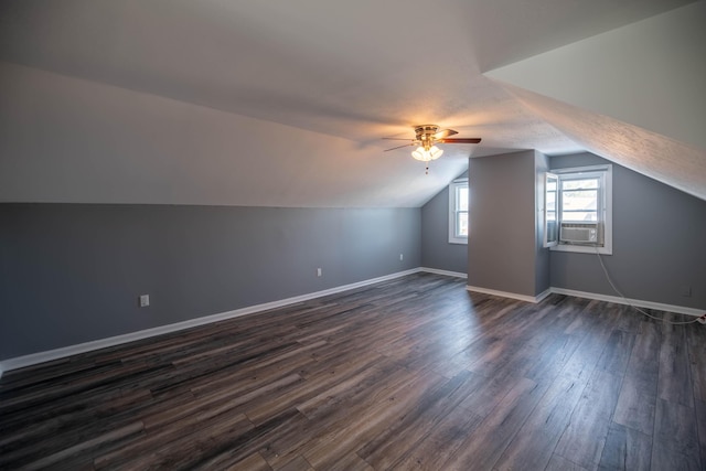 bonus room featuring vaulted ceiling, dark hardwood / wood-style floors, cooling unit, and ceiling fan