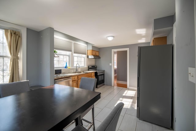 kitchen featuring stainless steel appliances and sink