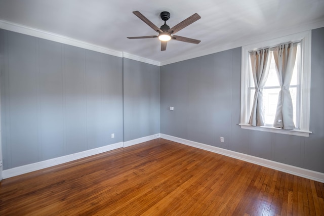 spare room with ornamental molding, hardwood / wood-style floors, and ceiling fan