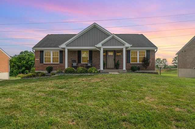 craftsman house with a lawn