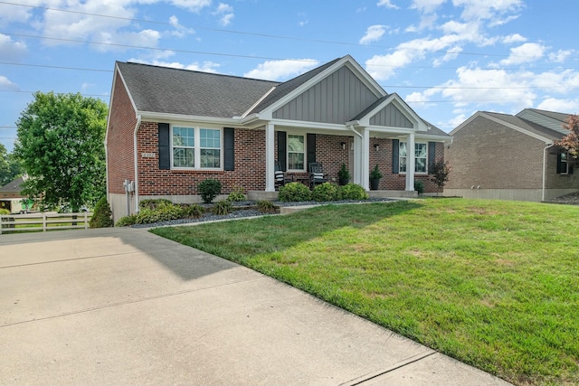 view of front of property with a porch and a front yard