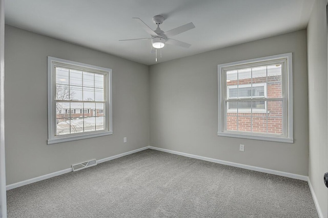 carpeted empty room with ceiling fan