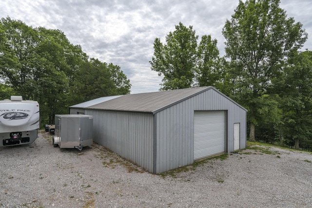 view of outbuilding with a garage