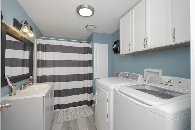 washroom featuring washer and clothes dryer and sink