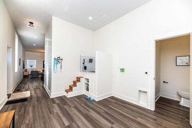 hallway featuring dark hardwood / wood-style flooring