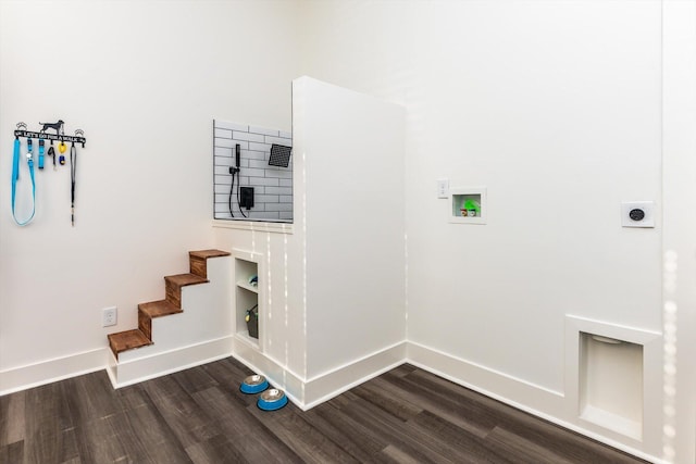 laundry area with hookup for an electric dryer, hookup for a washing machine, and hardwood / wood-style flooring