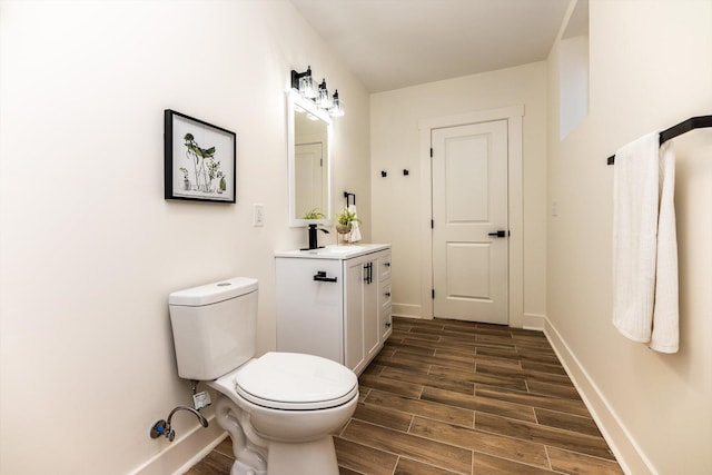 bathroom with toilet and vanity