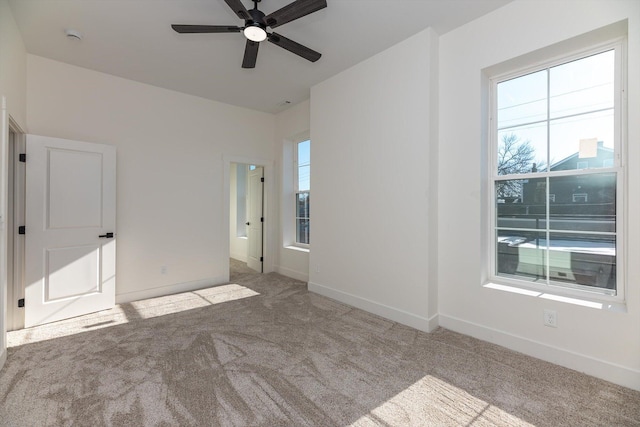 unfurnished bedroom featuring ceiling fan and light colored carpet