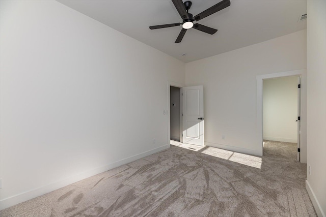 unfurnished bedroom featuring ceiling fan and light carpet