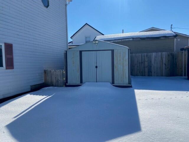 exterior space with a storage shed