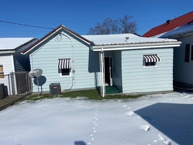 back of house featuring central air condition unit