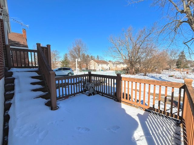 view of snow covered deck