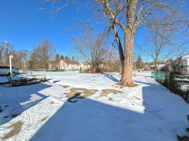 view of yard layered in snow