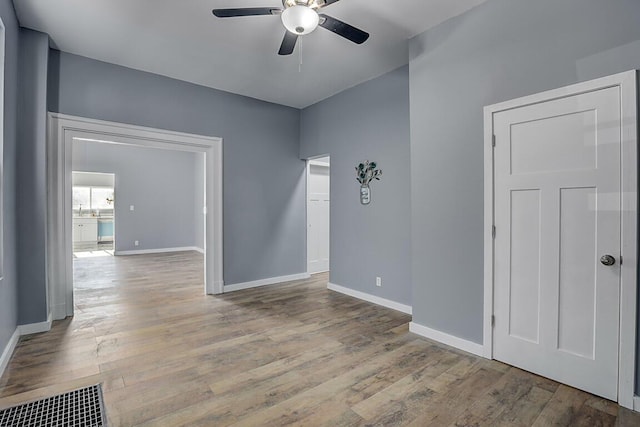 spare room with ceiling fan and light hardwood / wood-style floors