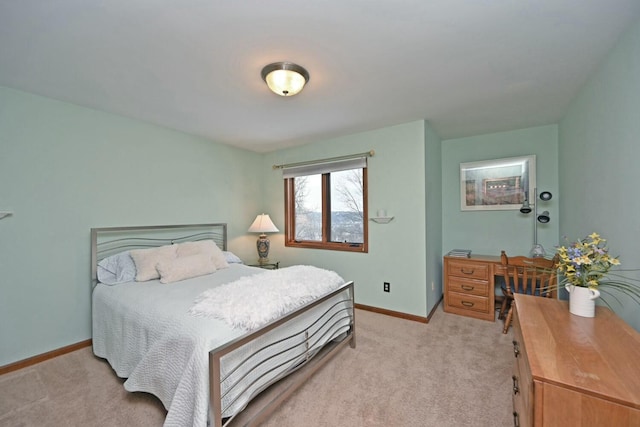 bedroom featuring light carpet