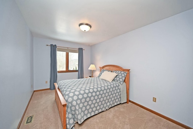 bedroom with light carpet