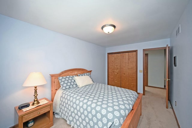 carpeted bedroom with a closet