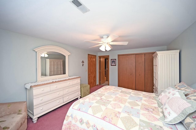 carpeted bedroom with a closet and ceiling fan