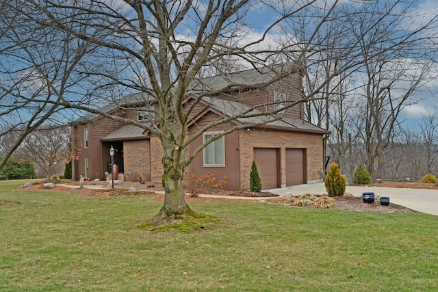 view of front of property with a garage and a front yard