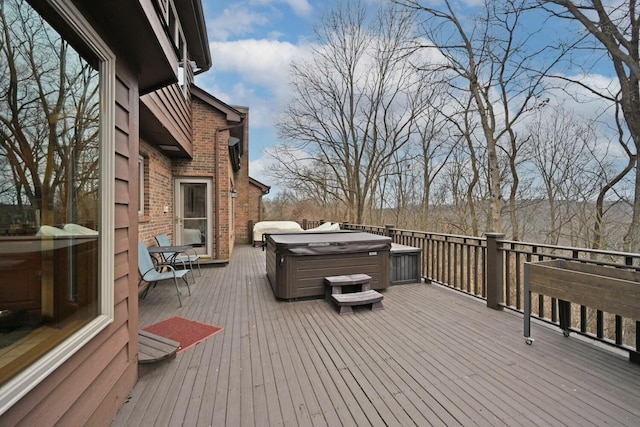 deck featuring a hot tub