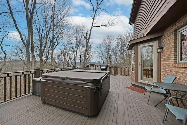 deck featuring a hot tub