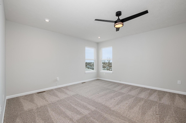 carpeted empty room with ceiling fan