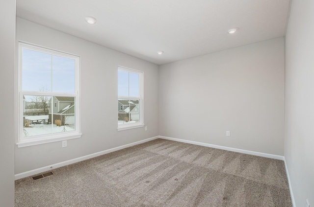 spare room featuring carpet floors