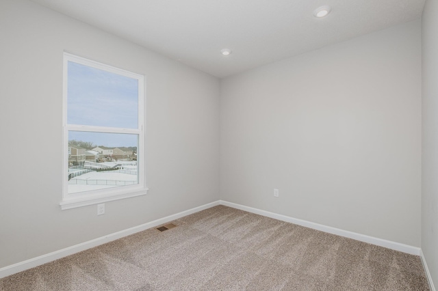 unfurnished room featuring carpet floors