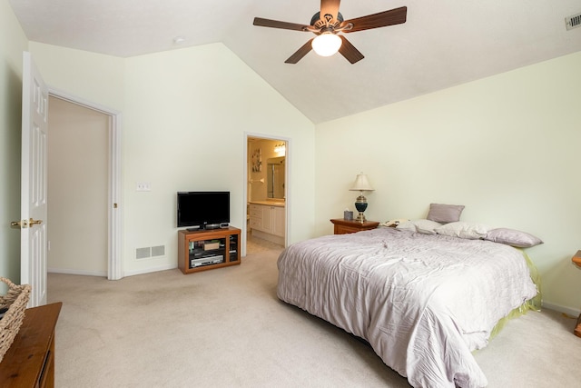 carpeted bedroom with lofted ceiling, connected bathroom, and ceiling fan