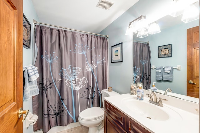 bathroom featuring tile patterned flooring, vanity, curtained shower, and toilet