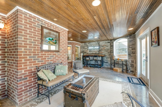 living room with wood ceiling and concrete flooring